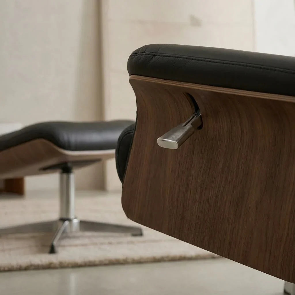 Black faux leather swivel recliner with footstool – close-up detail