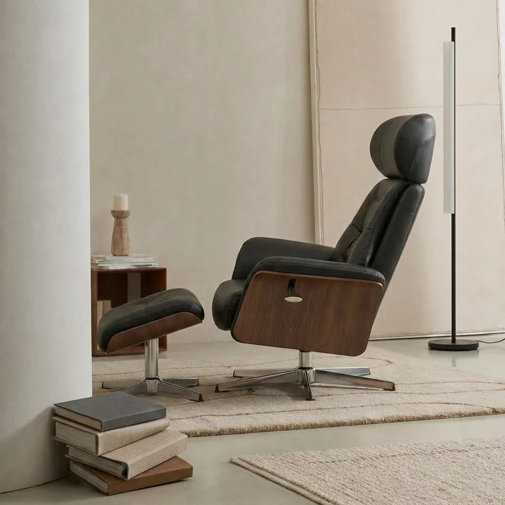 Black faux leather swivel recliner with footstool – side view