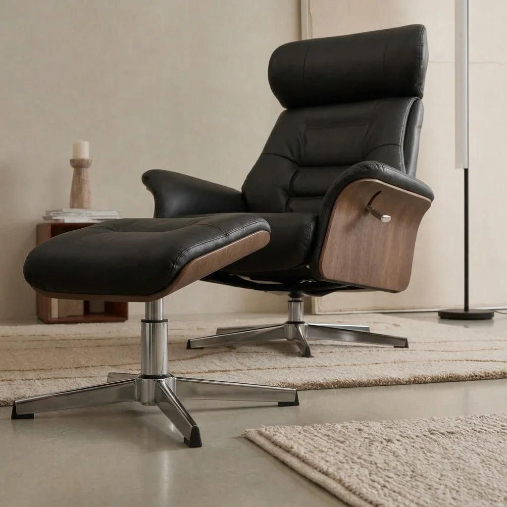 Black faux leather swivel recliner with footstool – three-quarter view