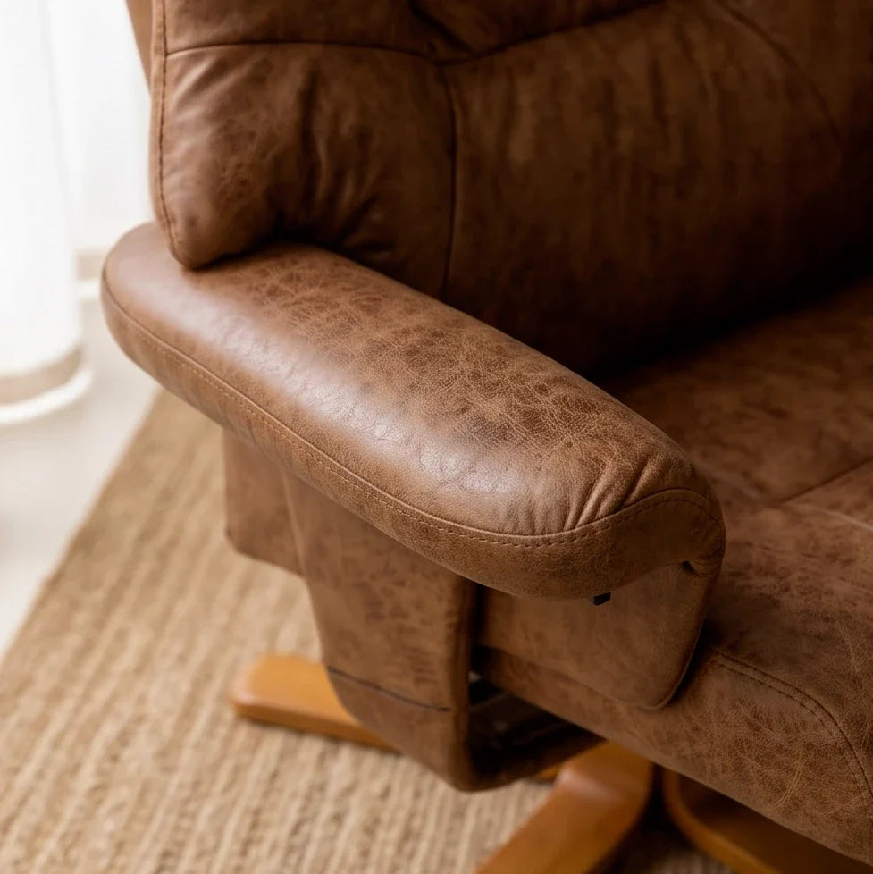 Brown microfibre swivel recliner armchair with footstool – close-up detail